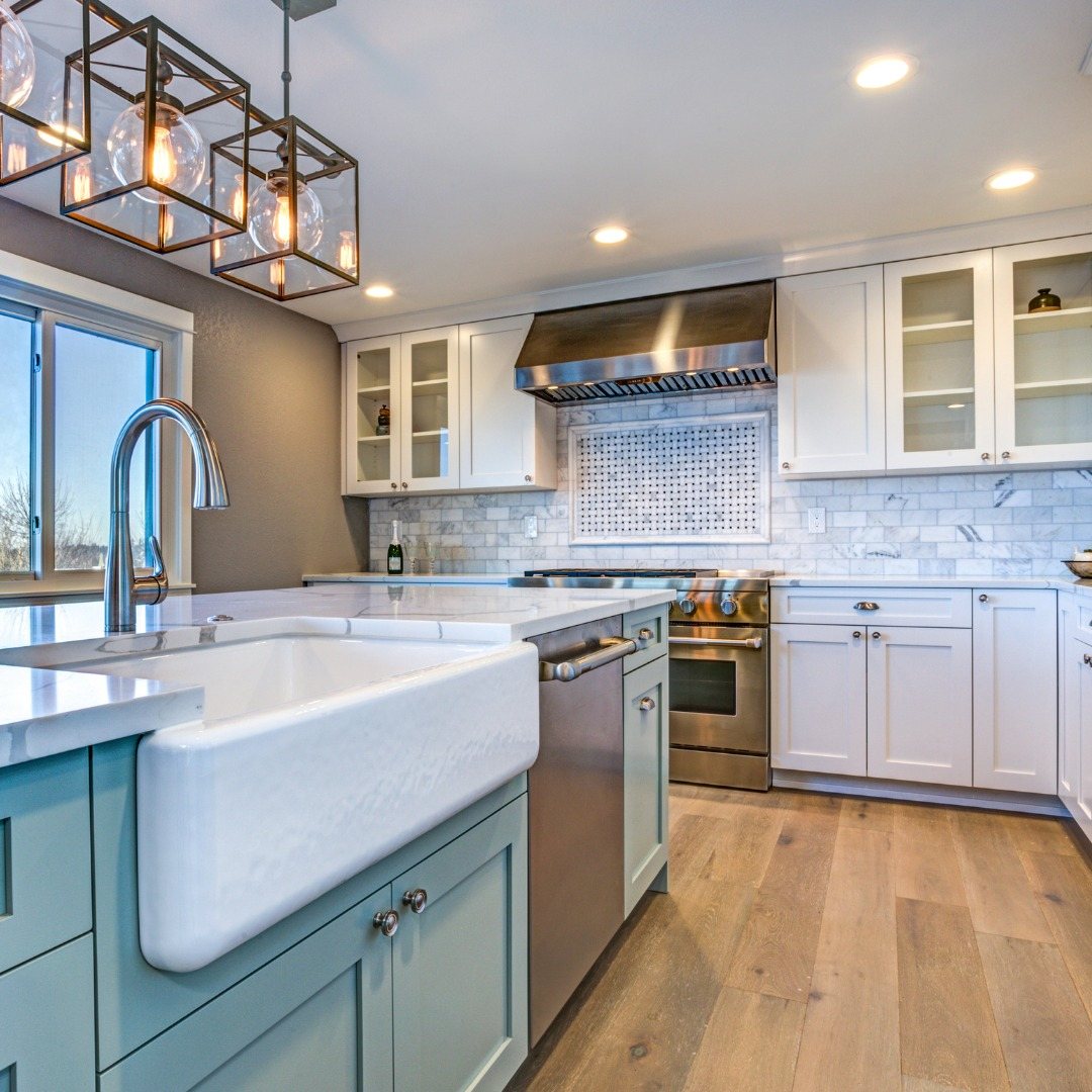 Remodeled kitchen with updated cabinets, countertops, sink, and lighting